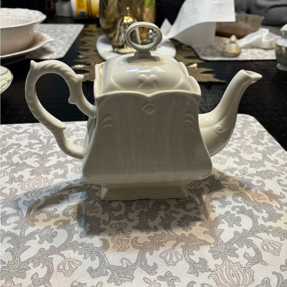 Elegant Cream Porcelain Teapot with Sculpted Handle